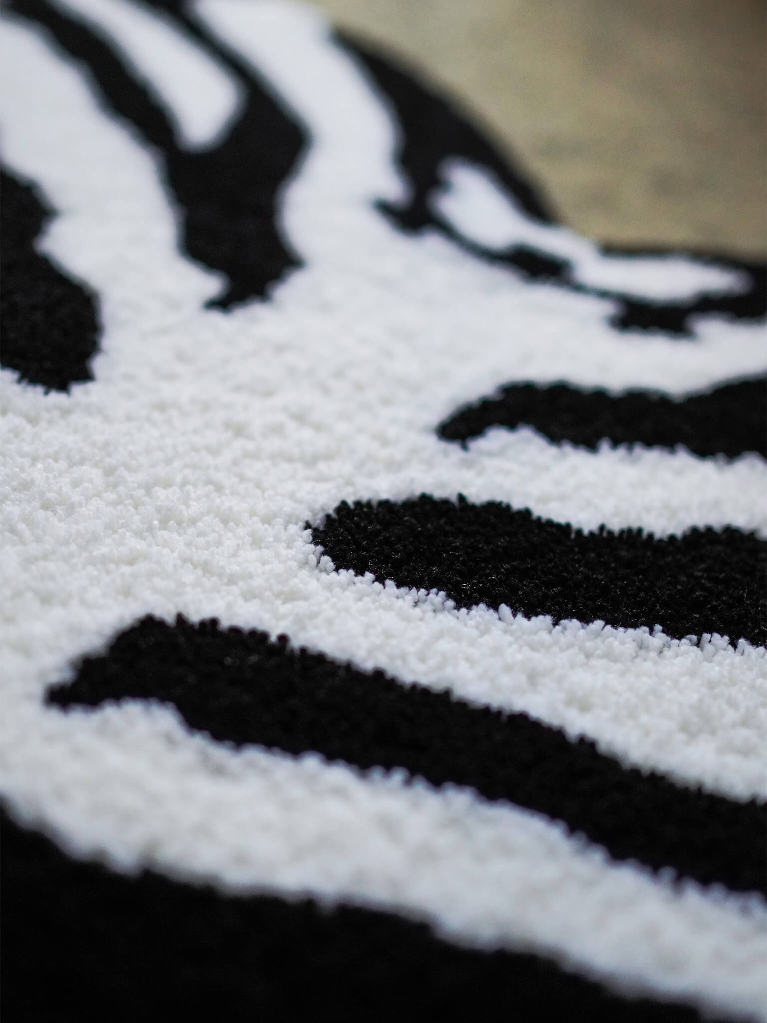 Close-up of the Ribcage Heart Rug, highlighting the meticulous Japanese craftsmanship.