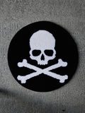 The Skull and Crossbones Circle Rug. A clean, classic underground tattoo design tufted in heavy black and white.